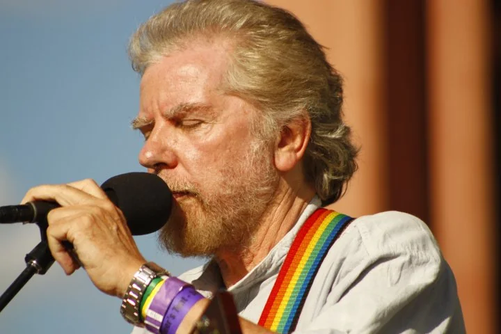 Tommy Sands singing into a microphone